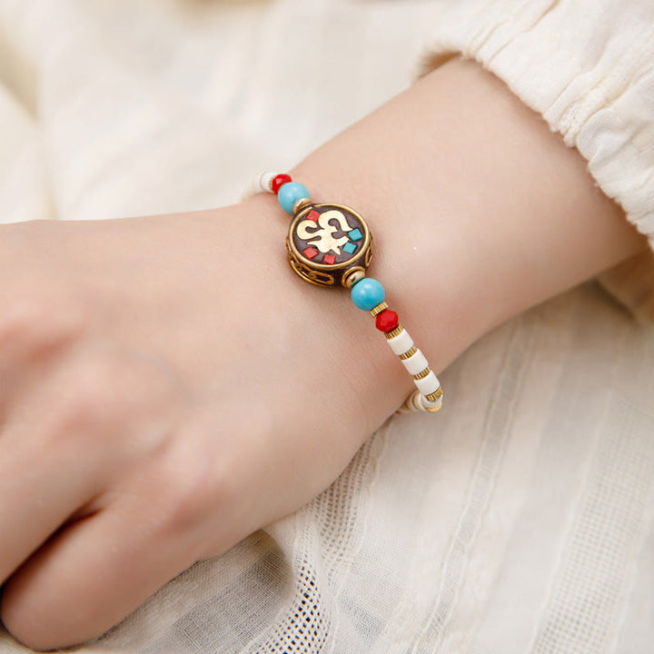 Bracelet de force de protection Om Mani Padme Hum en Buddha Stones tibétaines turquoise