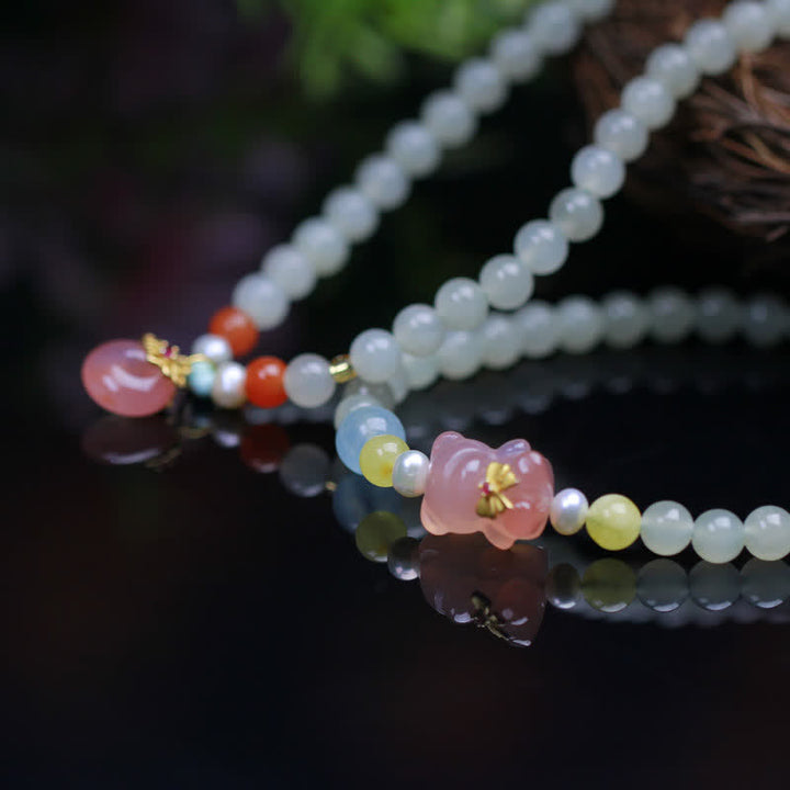 Bracelet en Buddha Stones en jade Hetian naturel avec cristal rose et boucle de paix pour le bonheur et l'abondance