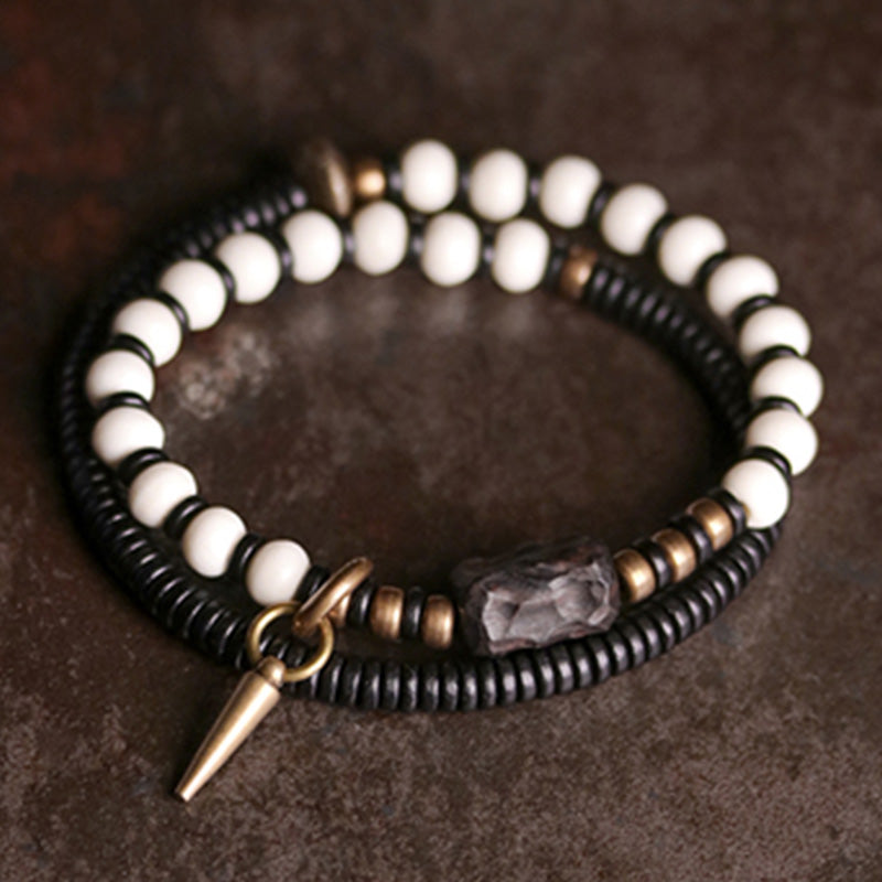 Bracelet couple force en bois d'ébène et cuivre, perles d'os et Buddha Stones