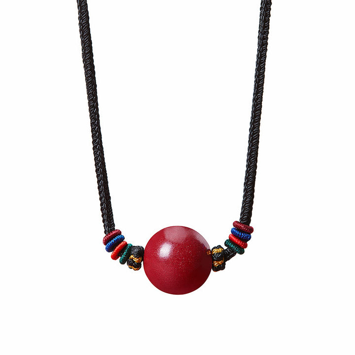 Collier avec pendentif en perles de cinabre et Buddha Stones