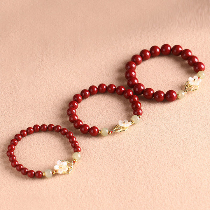 Bracelet de bénédiction en pierre de cinabre naturelle et jade Tridacna avec Buddha Stones