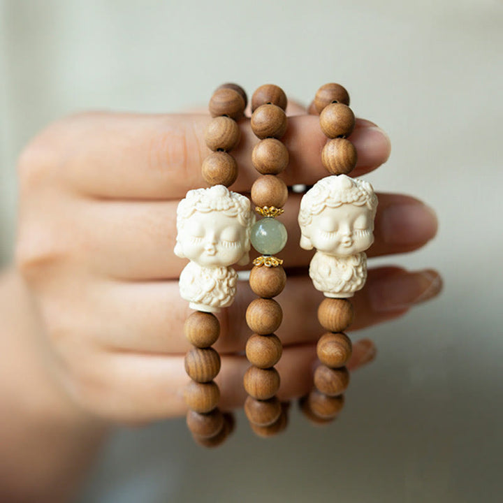 Bracelet de protection Tara verte en Buddha Stones en bois de santal et jade Hetian