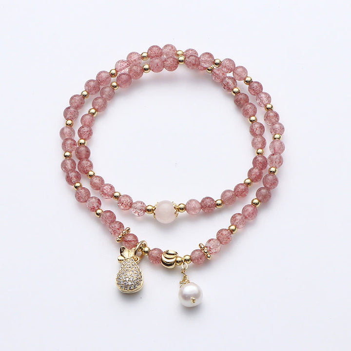 Bracelet double tour avec breloque positive et Buddha Stones en quartz fraise