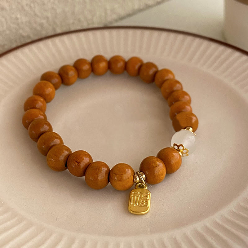 Bracelet de protection à breloques en bois de santal et œil de chat Fu avec Buddha Stones