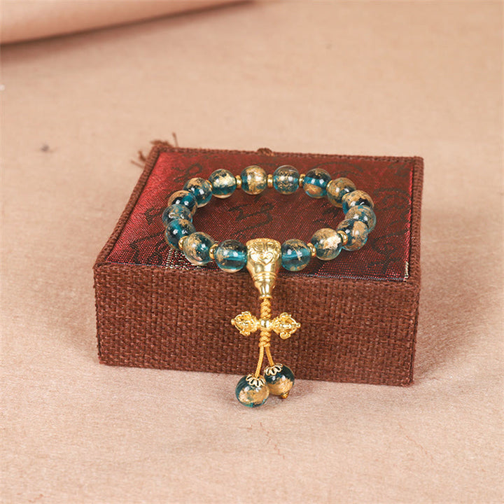 Bracelet de perles de force Dorje Vajra de la famille des bêtes avaleuses en or tibétain avec Buddha Stones