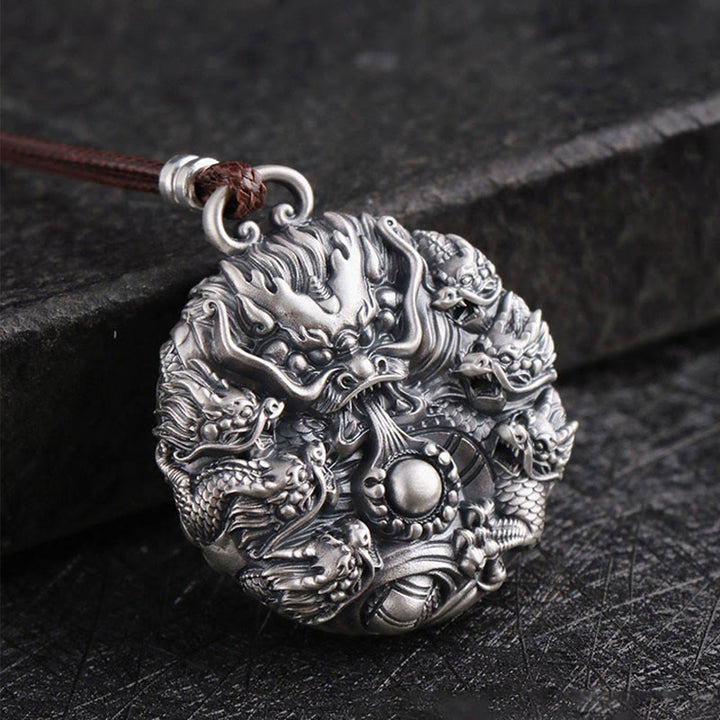 Collier de protection Buddha Stones en argent 999 Neuf dragons jouant avec une perle Pendentif de protection de la chance