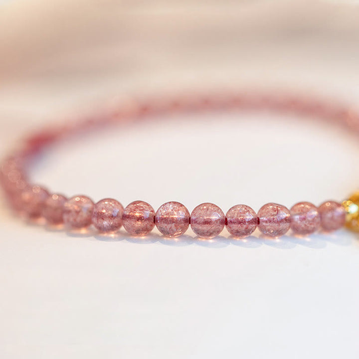 Bracelet porte-bonheur en Buddha Stones, quartz fraise, grenat, jade, caractère Fu