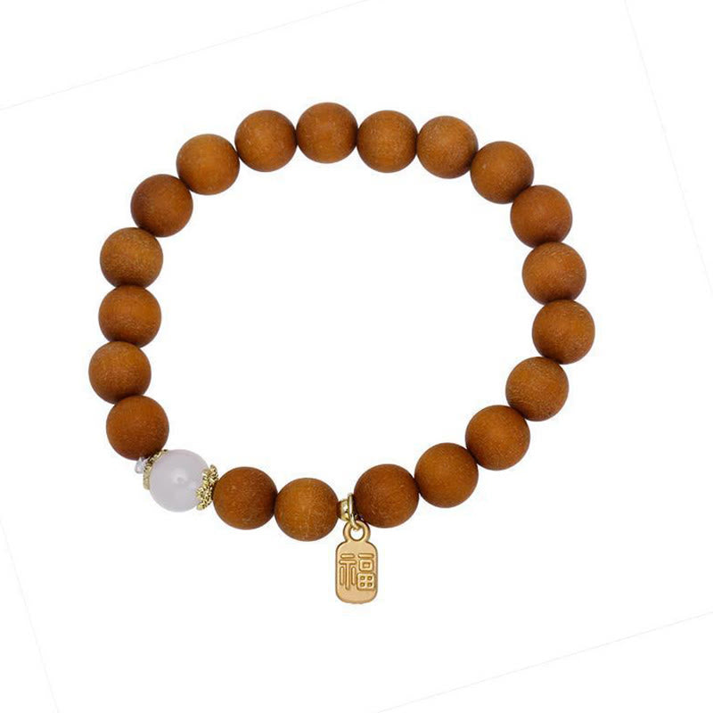 Bracelet de protection à breloques en bois de santal et œil de chat Fu avec Buddha Stones