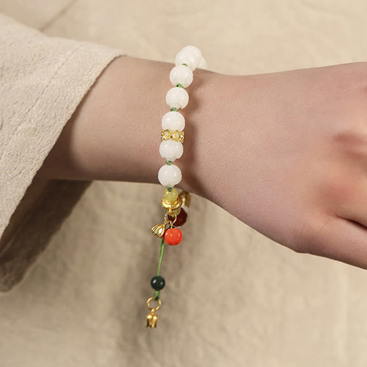 Bracelet d'harmonie et de paix en perles de citrouille et de lotus en Buddha Stones naturelles