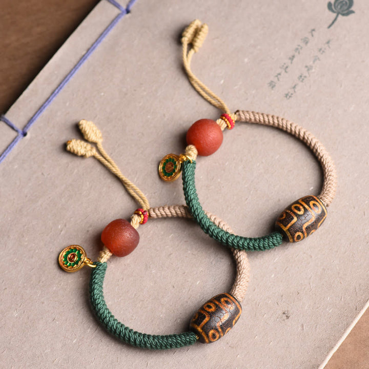 Bracelet en corde de richesse en perles tibétaines à neuf yeux Dzi fait main par Buddha Stones