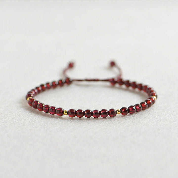Bracelet de stabilité en perles dorées et grenat naturel avec Buddha Stones