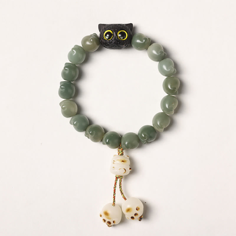 Bracelet de sagesse porte-bonheur en bois d'ébène avec de belles pattes et des graines de Bodhi naturelles de Buddha Stones - Graine de Bodhi verte - Version pompon (tour de poignet 14-15 cm) - image 15