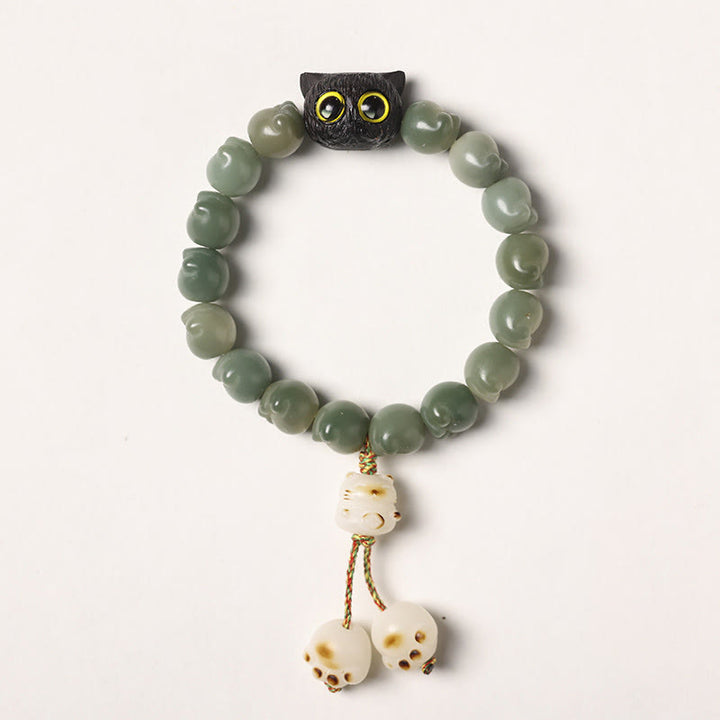 Bracelet de sagesse porte-bonheur en bois d'ébène avec de belles pattes et des graines de Bodhi naturelles de Buddha Stones - Graine de Bodhi verte - Version pompon (tour de poignet 14-15 cm) - image 15
