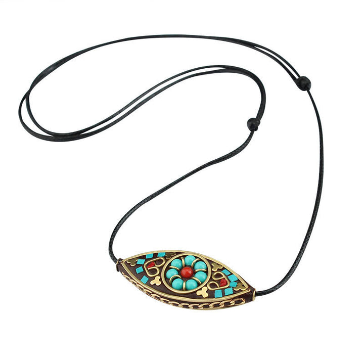 Collier pendentif en perles turquoises du Tibet avec Buddha Stones et motif marquise, protection et force