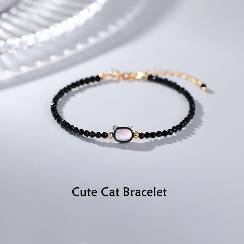 Bracelet de guérison en pierre tridacna avec spinelle noire et cristal blanc plaqué or 14 carats de Buddha Stones - Spinelle noir et pierre Tridacna - image 1