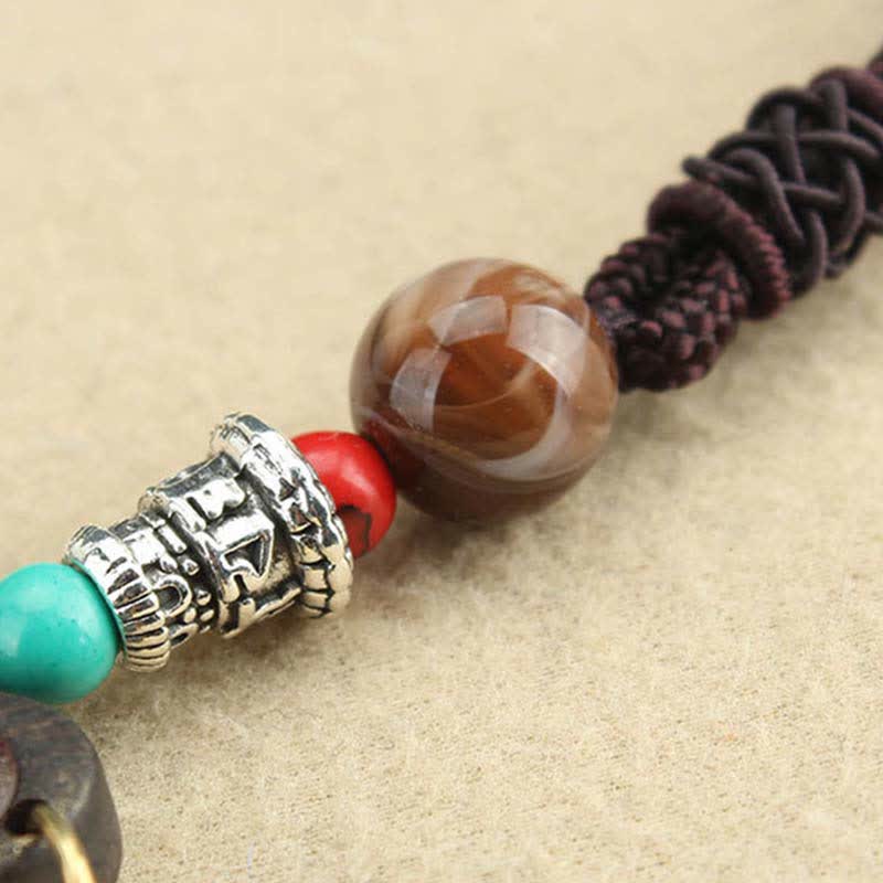 Collier pendentif Thangka en ébène du Tibet représentant les cinq dieux de la richesse