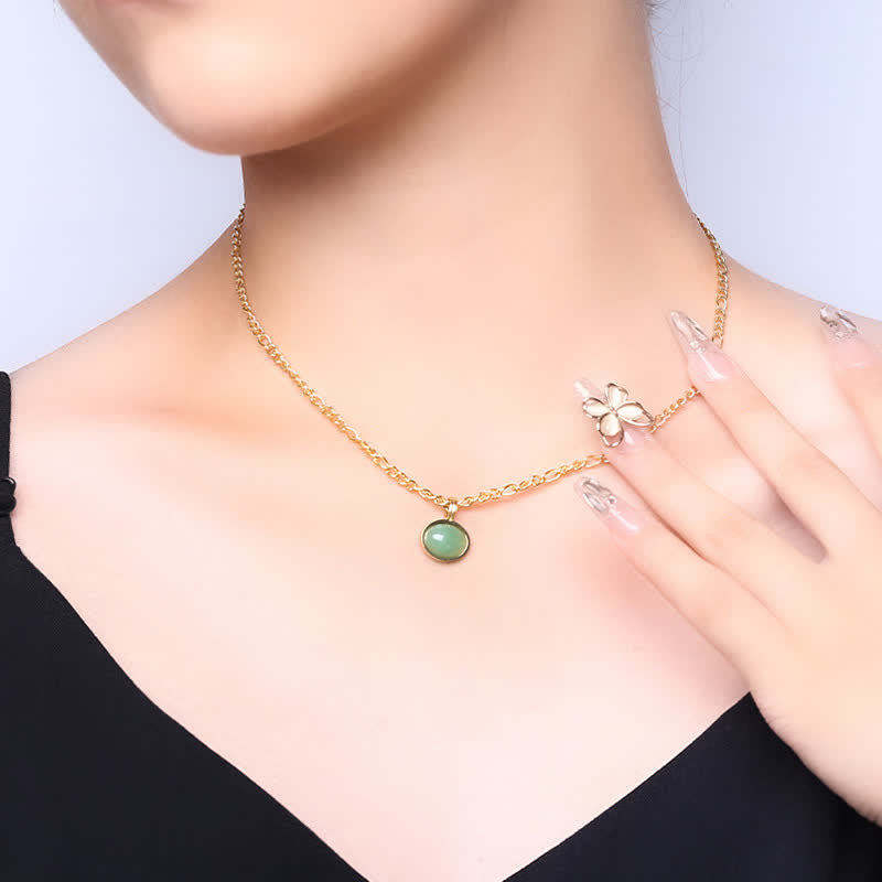 Collier pendentif ovale en acier titane et turquoise