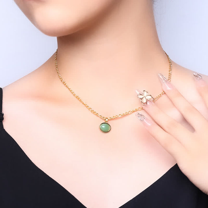 Collier pendentif ovale en acier titane et turquoise