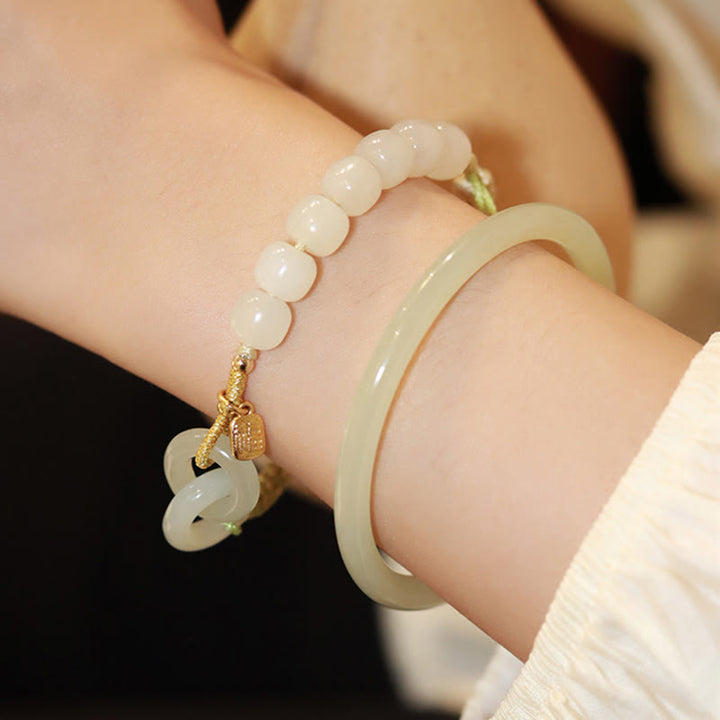 Bracelet tressé en perles de jade Hetian naturelles de Buddha Stones avec boucle de paix double et caractère Fu