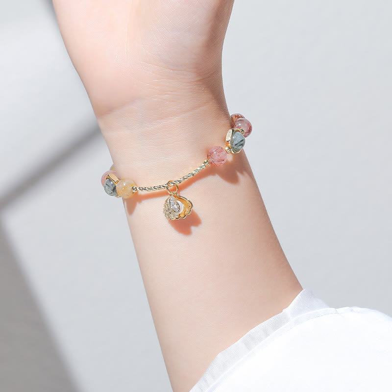 Bracelet de perles de protection en coquillage de quartz rutile coloré naturel de Buddha Stones