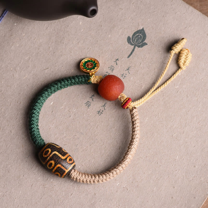 Bracelet en corde de richesse en perles tibétaines à neuf yeux Dzi fait main par Buddha Stones