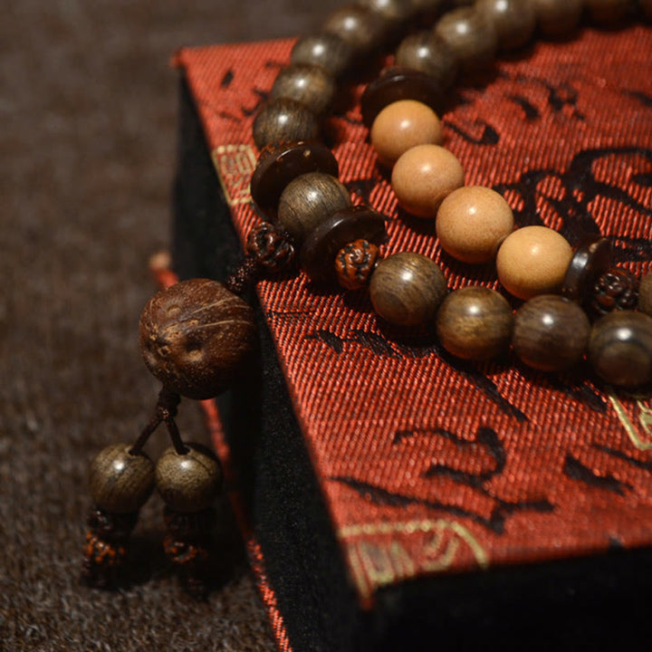 Bracelet Mala avec breloque de protection en bois de santal tibétain et Buddha Stones