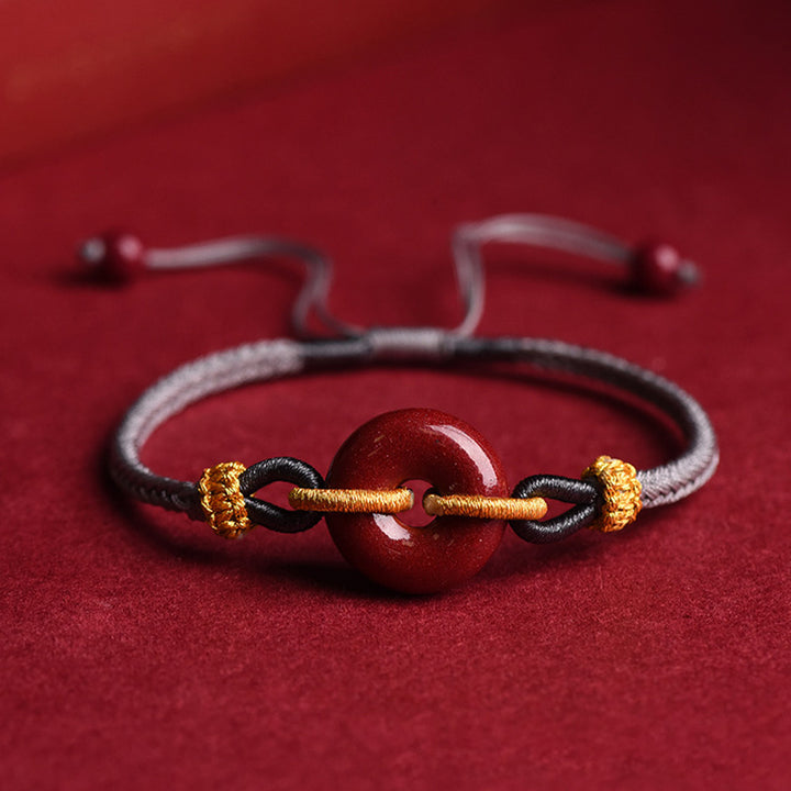Bracelet tressé à la main en cinabre avec boucle de paix et concentration de Buddha Stones