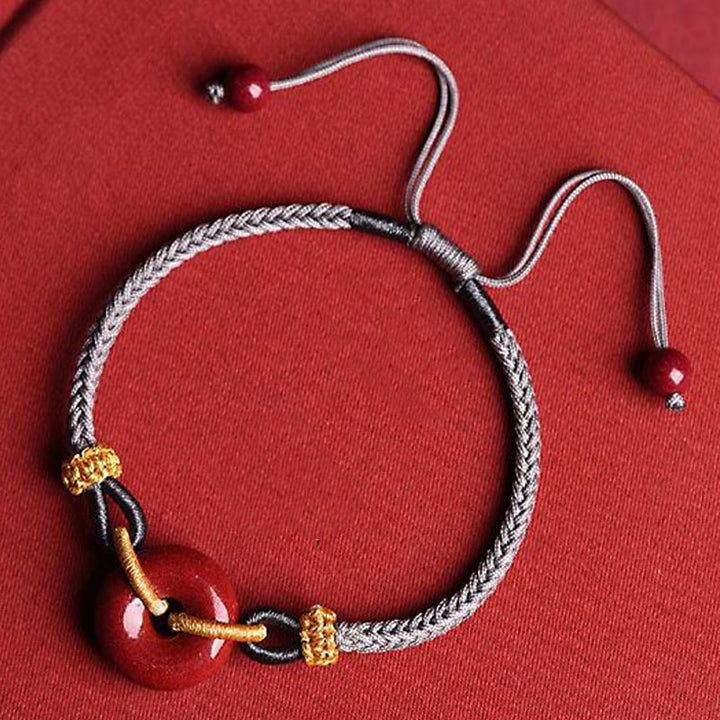 Bracelet tressé à la main en cinabre avec boucle de paix et concentration de Buddha Stones
