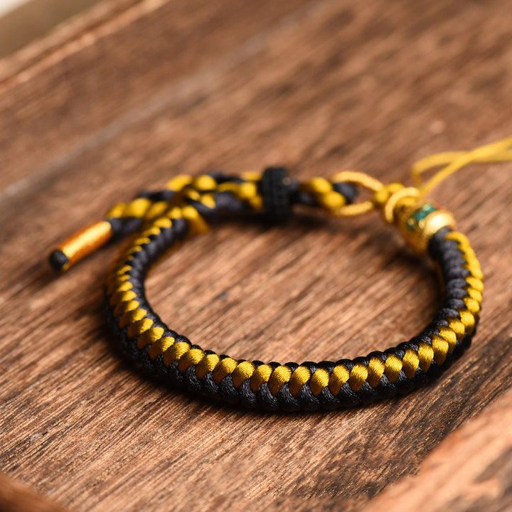 Bracelet en corde écailles de dragon tibétain en or noir fait main avec Buddha Stones Om Mani Padme Hum Pureté
