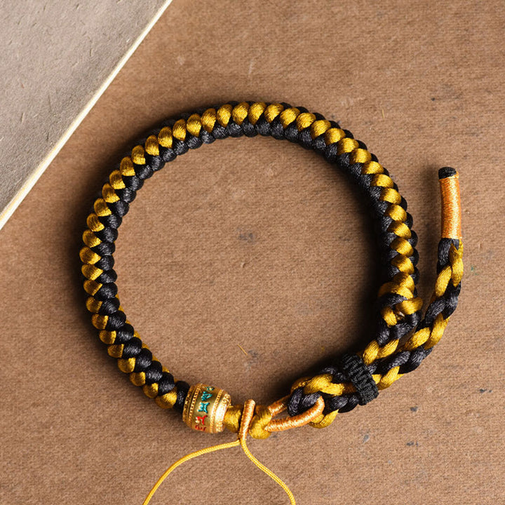 Bracelet en corde écailles de dragon tibétain en or noir fait main avec Buddha Stones Om Mani Padme Hum Pureté