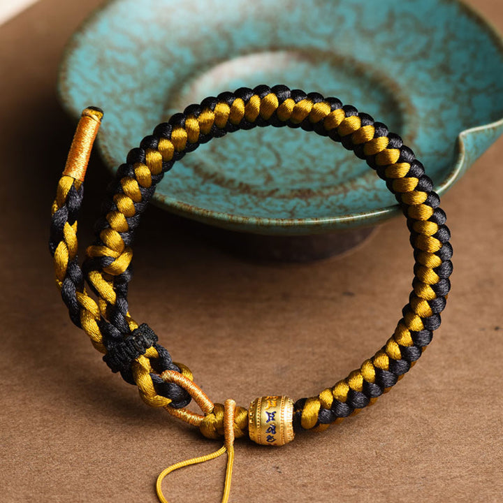 Bracelet en corde écailles de dragon tibétain en or noir fait main avec Buddha Stones Om Mani Padme Hum Pureté