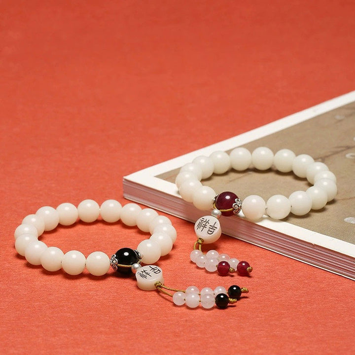 Bracelet Mala en Buddha Stones et graines de Bodhi, agate rouge, obsidienne noire, cristal rose, quartz rutile, paix