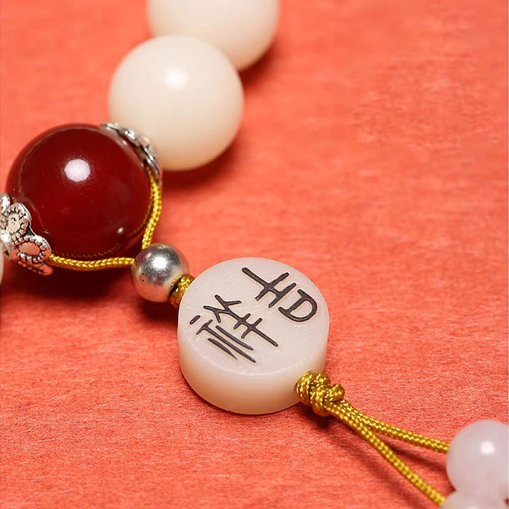 Bracelet Mala en Buddha Stones et graines de Bodhi, agate rouge, obsidienne noire, cristal rose, quartz rutile, paix