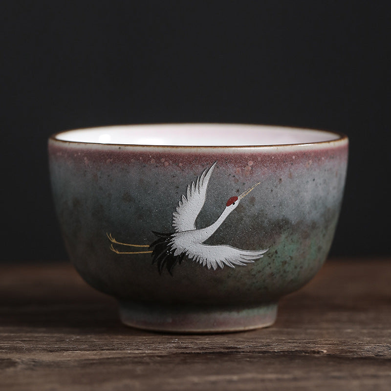 Tasse à thé en céramique avec grue de bon augure et Buddha Stones
