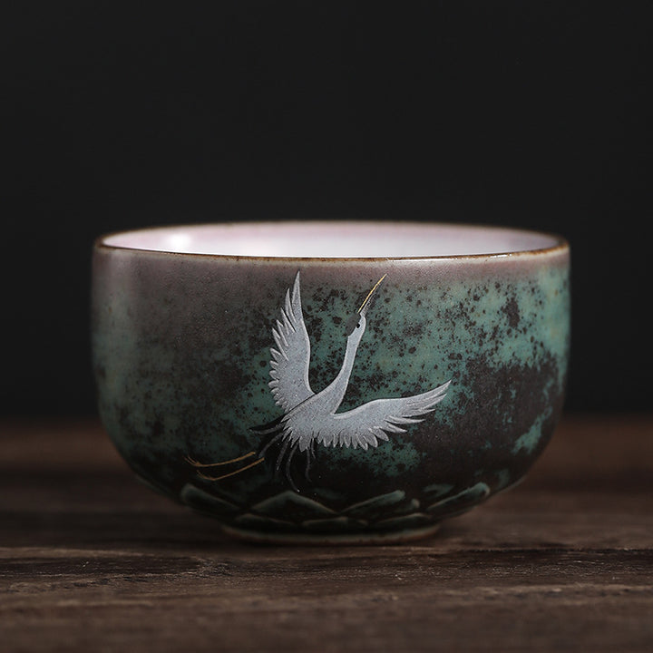 Tasse à thé en céramique avec grue de bon augure et Buddha Stones