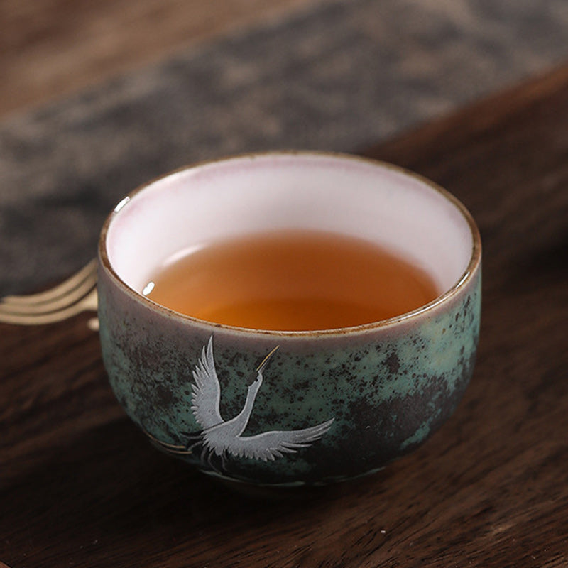 Tasse à thé en céramique avec grue de bon augure et Buddha Stones