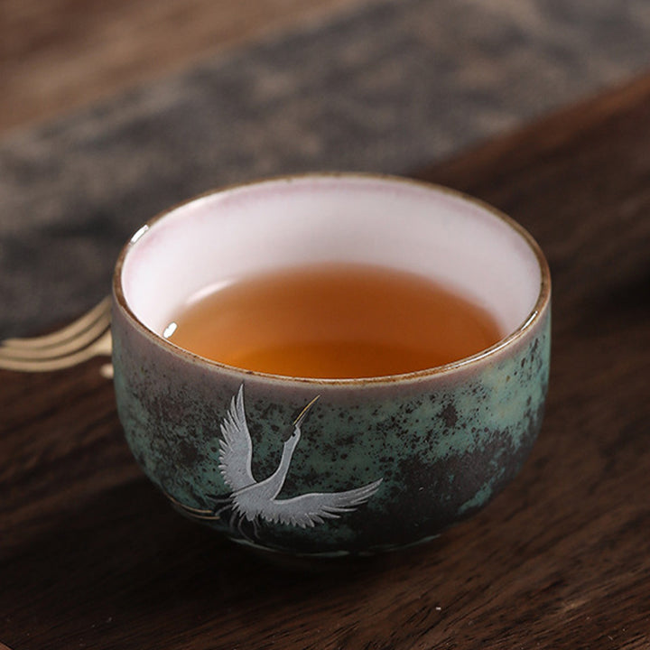 Tasse à thé en céramique avec grue de bon augure et Buddha Stones