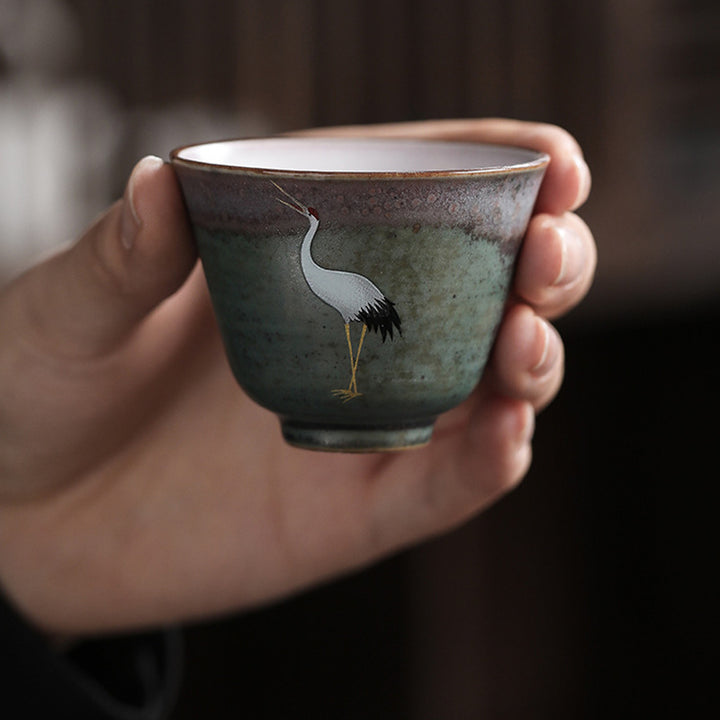 Tasse à thé en céramique avec grue de bon augure et Buddha Stones