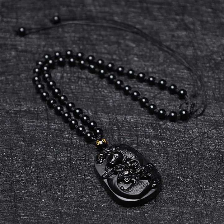 Collier avec pendentif en perles de force de lotus en obsidienne noire naturelle de Buddha Stones