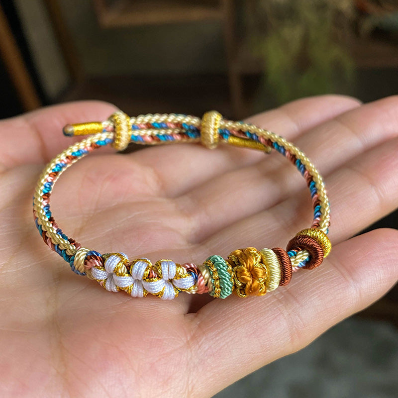 Bracelet tressé fait main en Buddha Stones avec motif de fleur de pêcher de couleur Dunhuang