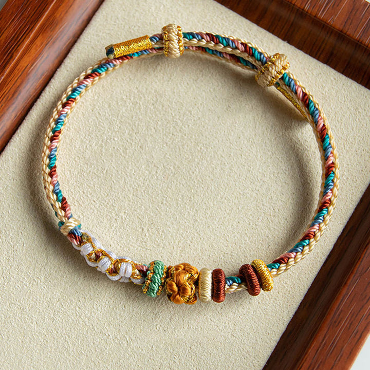 Bracelet tressé fait main en Buddha Stones avec motif de fleur de pêcher de couleur Dunhuang