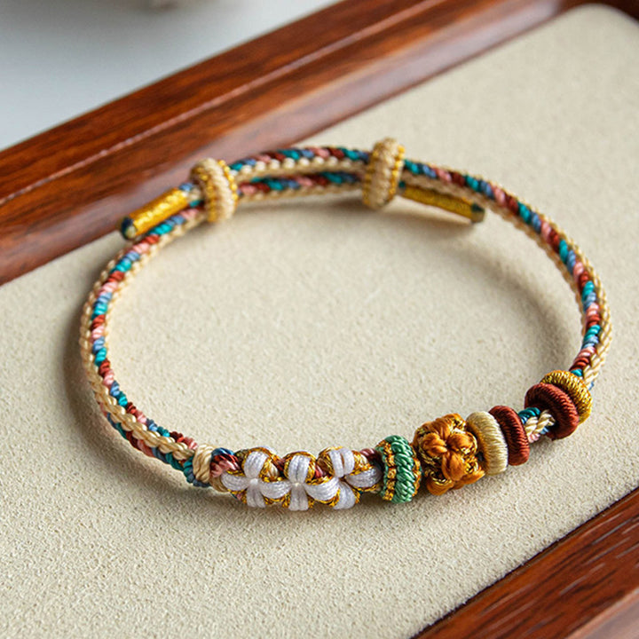Bracelet tressé fait main en Buddha Stones avec motif de fleur de pêcher de couleur Dunhuang