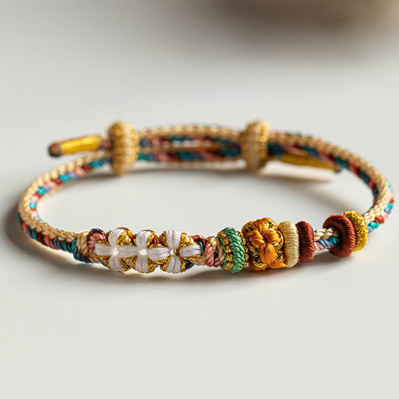Bracelet tressé fait main en Buddha Stones avec motif de fleur de pêcher de couleur Dunhuang