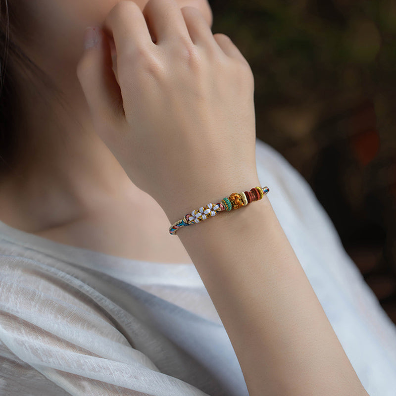 Bracelet tressé fait main en Buddha Stones avec motif de fleur de pêcher de couleur Dunhuang