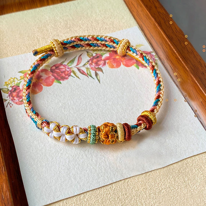 Bracelet tressé fait main en Buddha Stones avec motif de fleur de pêcher de couleur Dunhuang