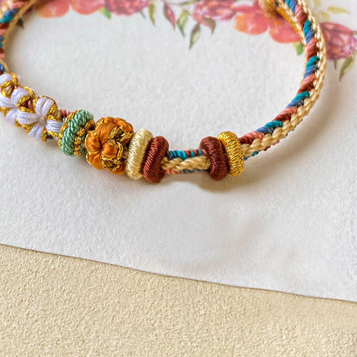 Bracelet tressé fait main en Buddha Stones avec motif de fleur de pêcher de couleur Dunhuang