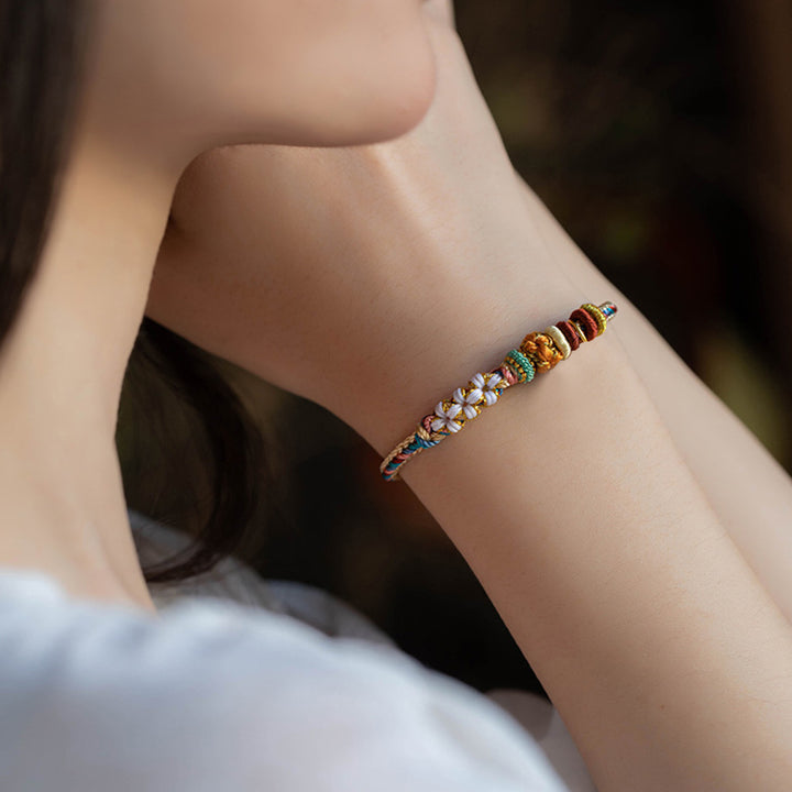 Bracelet tressé fait main en Buddha Stones avec motif de fleur de pêcher de couleur Dunhuang