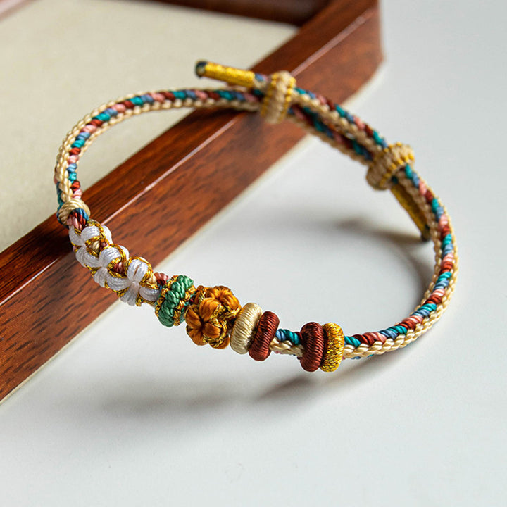Bracelet tressé fait main en Buddha Stones avec motif de fleur de pêcher de couleur Dunhuang