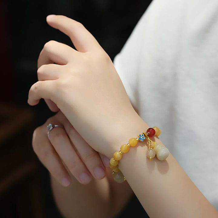 Bracelet porte-bonheur en jade doré et soie naturelle Buddha Stones