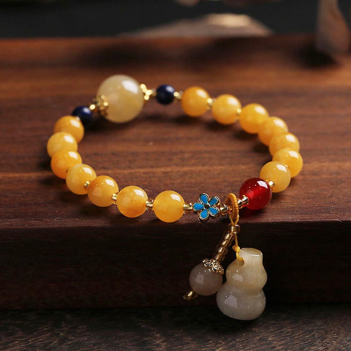 Bracelet porte-bonheur en jade doré et soie naturelle Buddha Stones